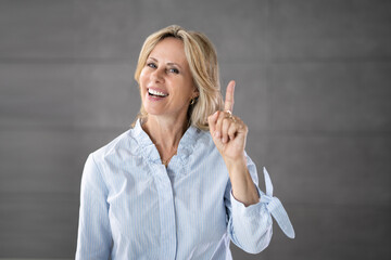 Old Senior Grandmother Woman With Finger Up