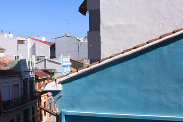Spanish small town landscape with colored houses and clear blue sky closeup photo