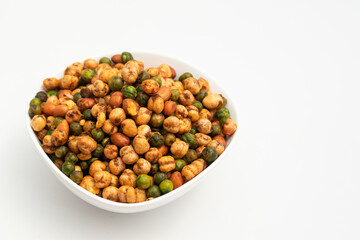 Cocktail Mix Namkeen Mixture Also Called Tedhe Medhe Chakhna Made Of Mixed Nuts Like Kabuli Chana Mungfali Hara Matar Kabli Channa And Moongfali Badam. Isolated On White Background With Copy Space