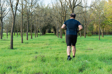 Overweight young man jogging in the park - Weight loss concept - Big belly male running, doing cardio in park – Runner  running on the road.