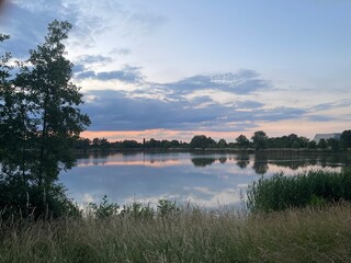 Obraz premium sunset over the river