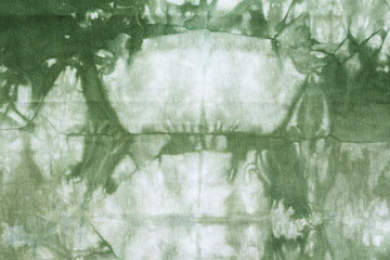 green abstract pattern handcrafted in Shibori technique on cotton jersey fabric