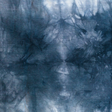 gray abstract pattern handcrafted in manual tie-dyeing technique on cotton jersey fabric