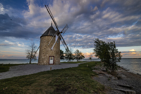 Old stone windmill with four blades.