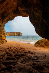Fototapeta premium Natural cave in the Algarve on the beach at Praia da Coelha, Albufeira. Portugal