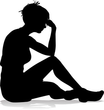 A silhouette woman looking relaxed sitting on the floor or ground thinking