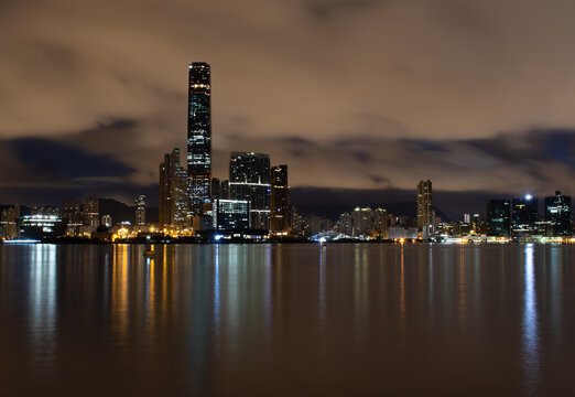 Dawn breaks.  Early morning long exposure photo of the Kowloon waterfront, Hong Kong with the International Commerce Centre.