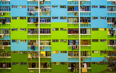 Fototapeta na wymiar Painted tenement. Blue and green iconic residential tenement building in Hong Kong