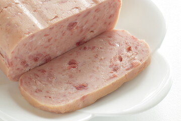 sliced luncheon meat on dish for prepared food ingredient
