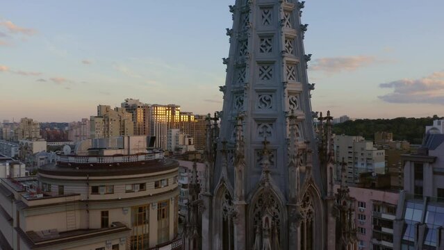 Evening cityscape and St Nicholas Roman Catholic Church of St Nicholas. Kiev city and sunset sky.