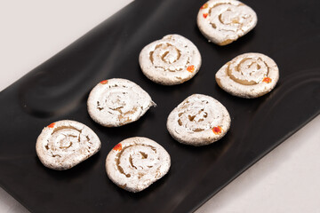 Indian Mithai Kaju Jalebi Also Known As Kaju Katli, Kaju Dilkhush Is Spiral Shaped Sweet Made Of Cashew Nut Powder, Kajoo, Mawa, Mava, Malai, Khoya, Doodh, Badam, Khoa, Badaam, Pista In Sugar Syrup