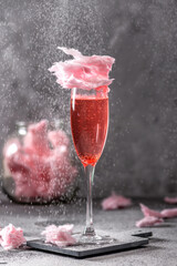 Pink cocktail with pink cotton candy