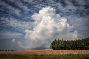 Fototapeta na wymiar Storm cloud on the horizon. nature environment severe weather huge cloud in the sky stormy cloud. Bayern Germany.