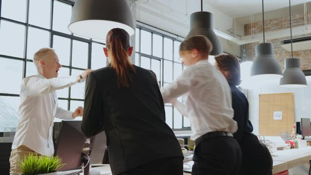multi-generation business people rejoices ,celebrates and clapping hands their financial and economic success. The businessman worker is excited about good news and business deal