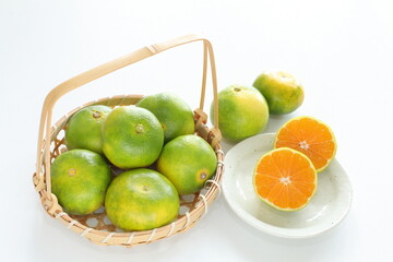 Japanese autumn fruit, early mandarin orange in bamboo basket