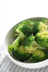 Boiled vegetable, broccoli in white background with copy space