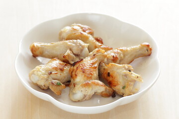 Barbecue grilled chicken drumsticks on plate with copy space