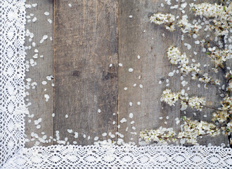 Spring blooming branches on wooden background.