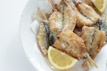 Japanese food, deep fried spotted sardine fish served with lemon