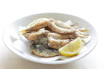 Japanese food, deep fried spotted sardine fish served with lemon