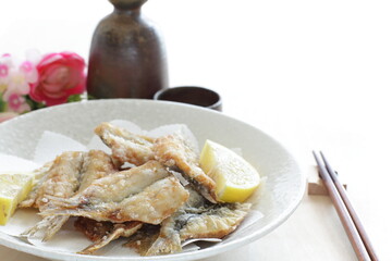 Japanese food, deep fried spotted sardine fish served with lemon