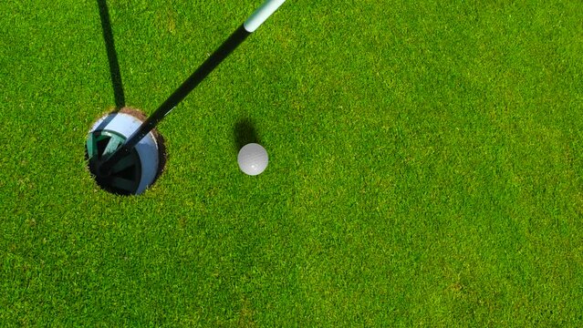 Golf Video Of A Ball Just Missing The Hole On A Putting Green, With Copy Space