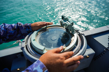 Compass on a military ship sailing on the sea