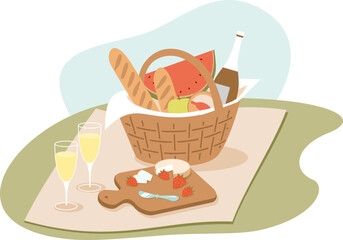 Picnic basket with food on green sunny lawn.