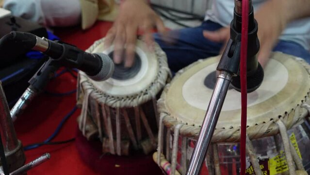 Tirupati, India 16th August 2022: Indian musicians and devotees soulfully singing bhajans and chants. Offerings to Hindu gods and Godesses. Popular music instruments used during bhakti and satsangs.