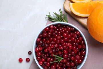 Flat lay composition with fresh ripe cranberries on light table