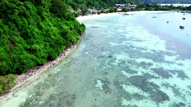 Koh phi phi island at thailand. Aerial drone view from island  coast line. sunny day resort and hotels blue wateer