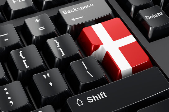 Danish flag painted on computer keyboard. Online business, education, shopping in Denmark concept. 3D rendering