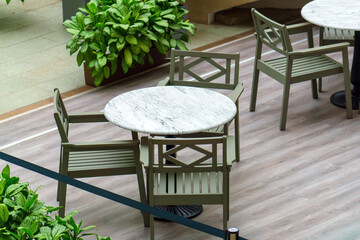 Round table with stone chairs in the restaurant