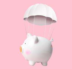 White piggy bank with parachute flying on pink background