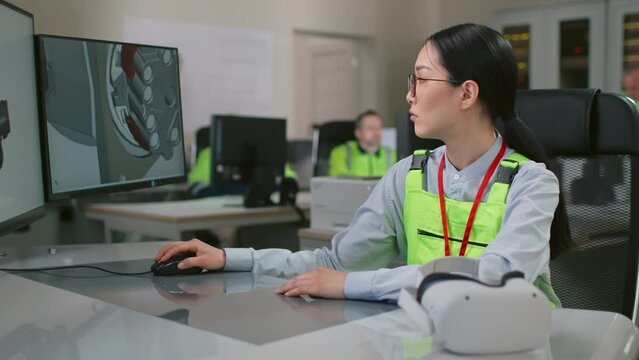 Portrait of female industrial engineer work with cad software with 3d engine