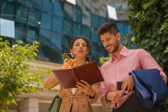 Cute business colleagues in the citry