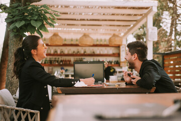 Business couple laughing