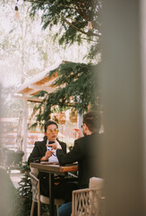 Business man showing something on the phone to his partner