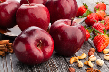 red delicious apple on wood background