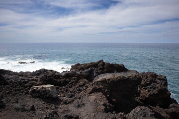 Fototapeta na wymiar Lava coastline and Atlantic Ocean, Lanzarote