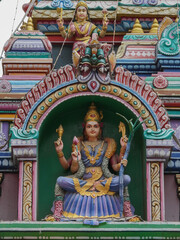 Traditional goddess's statue in the wall of temple 