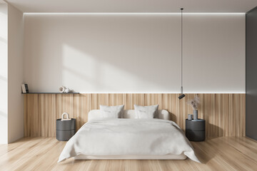 Light bedroom interior with bed and decoration on nightstand. Mockup wall