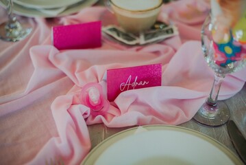 High-angle view of a pink decorated baby birthday table setting