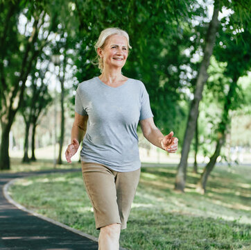 outdoor senior fitness woman lifestyle active sport exercise healthy fit elderly mature running jogging run runner jogger walking walk fast