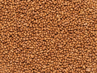 Buckwheat tea grain texture background. Top view of healthy ku qiao or soba tea groats canvas background. Minimal flat lay tartary buckwheat seeds. Copy space