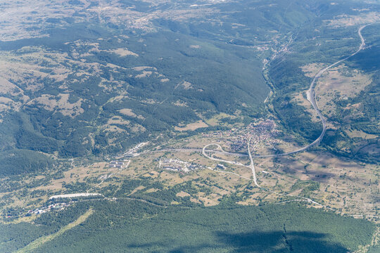 Assergi village and highway nearby aerial, Italy