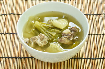 boiled pickled cabbage with pork bone in clear soup on bowl