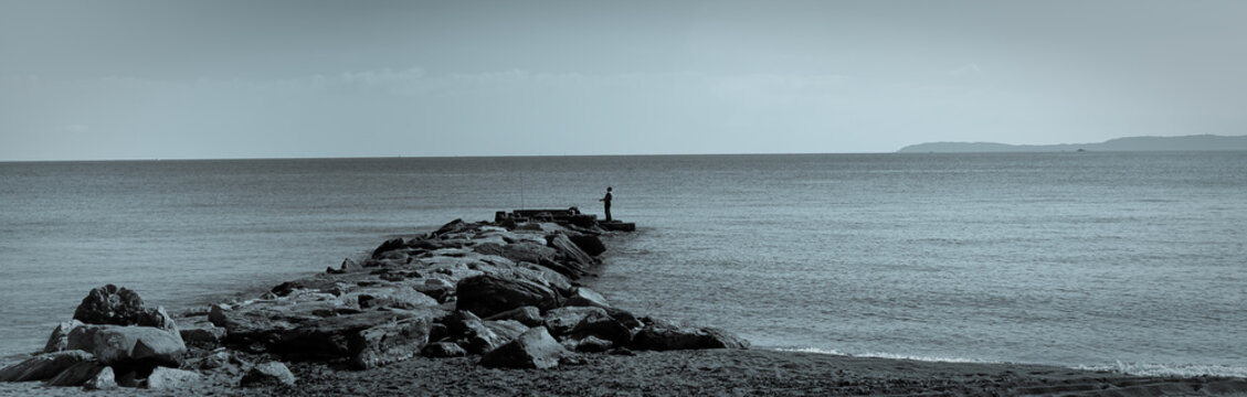 Angler am Meer