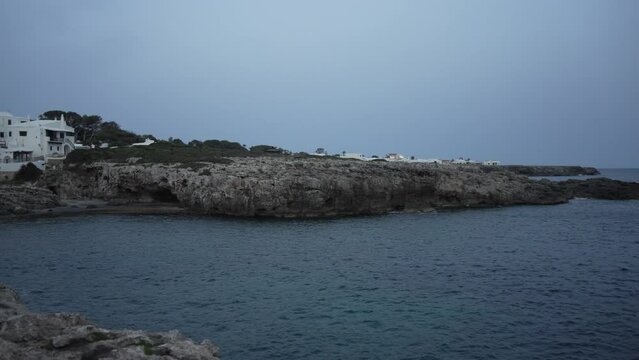 Whitewashed buildings in Binibeca Vell at dusk, Punta Prima, Menorca, Balearic Islands