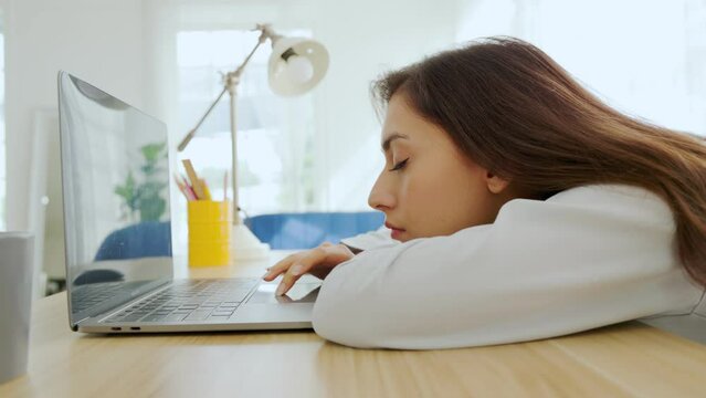 woman tired of work and not inspiration lazy apathetic look at laptop